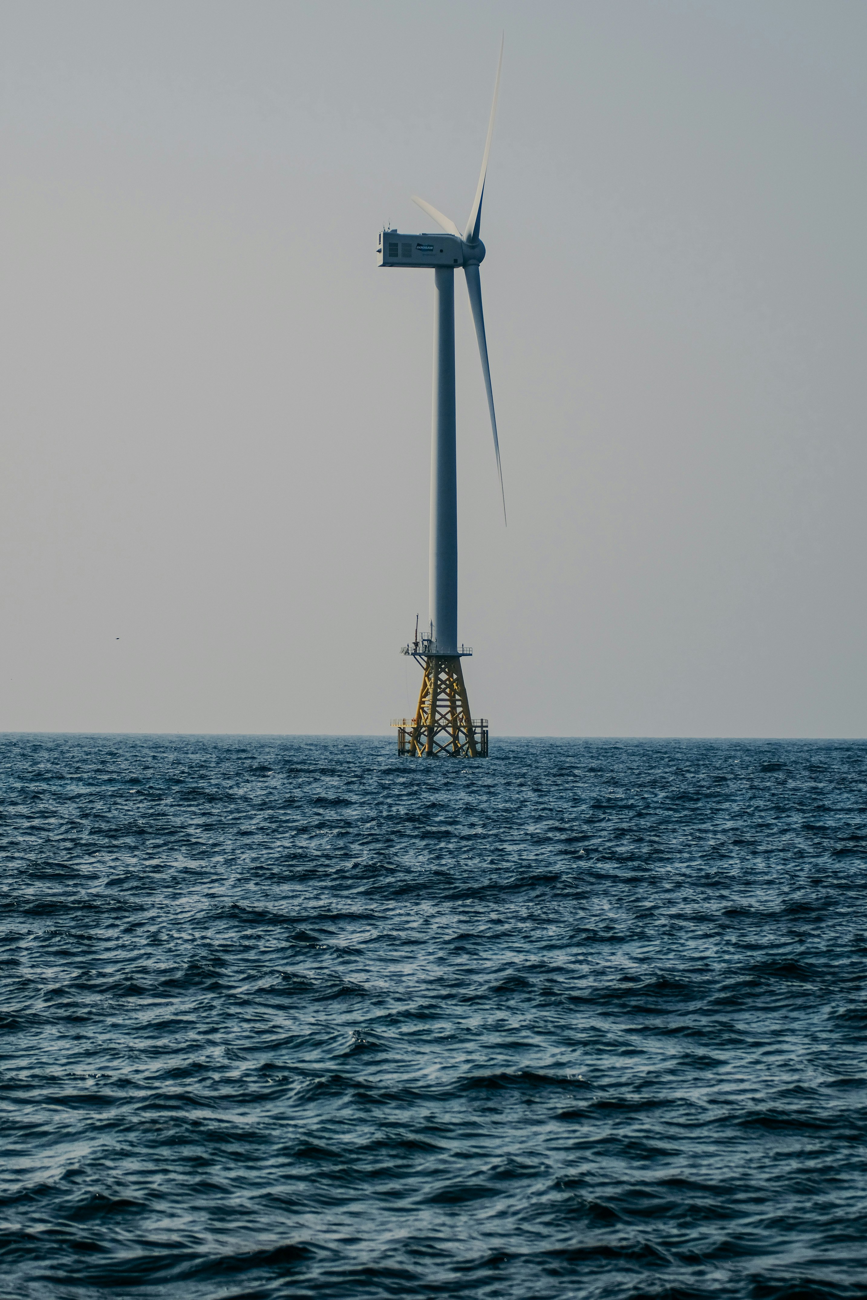 yellow and white ship on sea during daytime